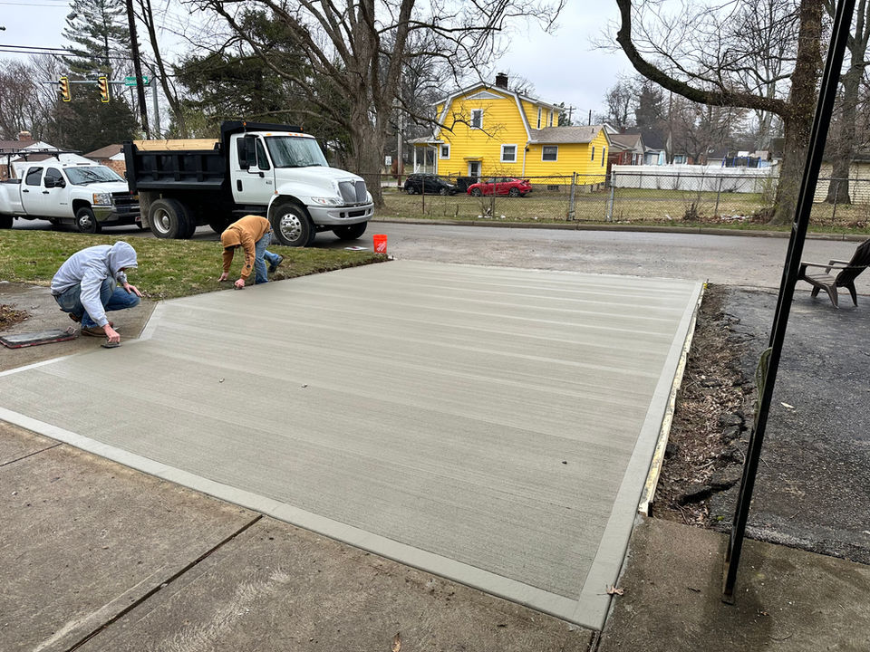 Viking concrete workers laying concrete for a driveway