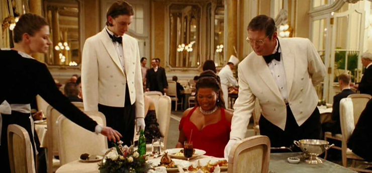 Last Holiday: Georgia receives the entire menu of Chef Didier, with “no exceptions,” a point of extreme indulgence and pleasure for her character. This shot shows Georgia clad in a stunning red dress that points to her character’s newly found confidence in indulgence.