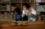 301/302: Figure 1: A terrified 302 averts her eyes as 301 angrily instructs her to eat the food she found in 302’s trash.