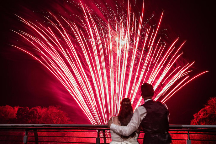 a bride and groom watch fireworks after their wedding at the Kinsale Hotel and Spa in Cork, Ireland