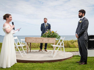 A bride and groom during their outdoor wedding ceremony