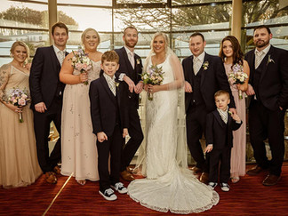 A wedding party pose on the stairs in the Kinsale Hotel and Spa