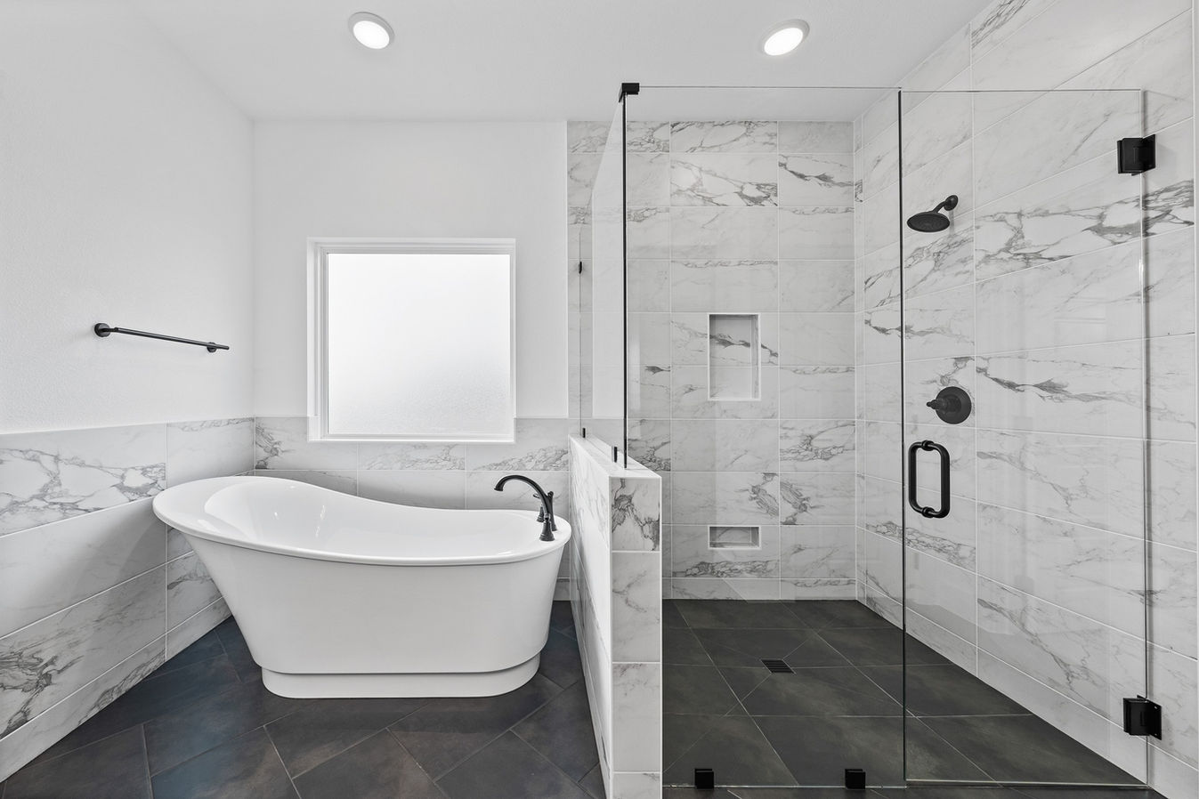 Luxury master bathroom in Salado, TX, with a walk-in shower, double vanity, and spa-like ambiance.