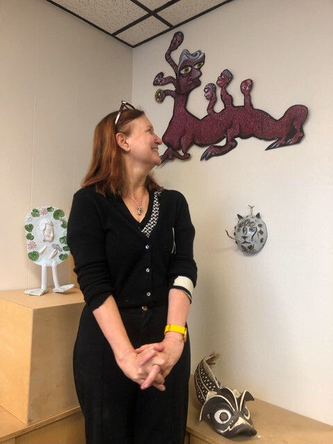 Gallery Director Leigh admiring her piece