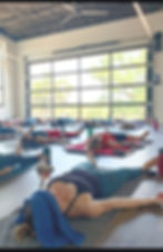 Yin yoga class with long holds and calming environment at Del Sol Texas