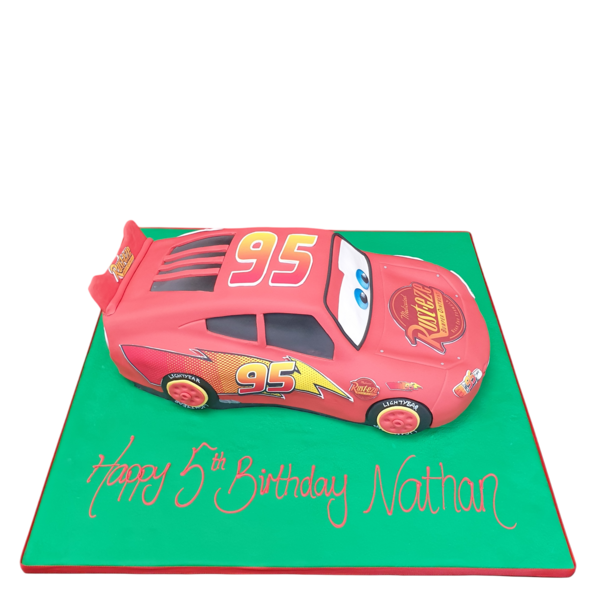A vibrant Lightning McQueen Cars themed birthday cake with intricate details and colourful accents, perfect for a themed celebration.
