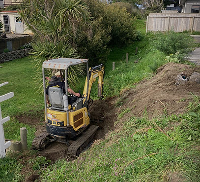 action shot of our digger at a customers house in the kapiti coast