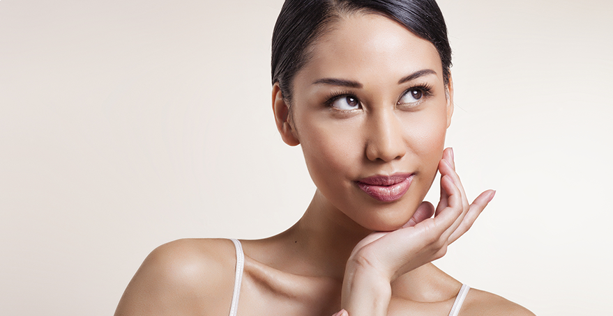 Woman contemplating leaving her makeup on overnight