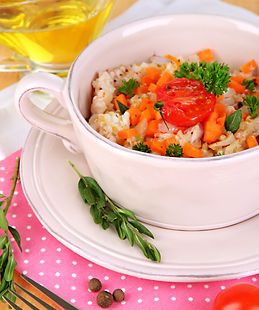 delicious-rice-with-vegetables-herbs-pot-wooden-table-closeup-min.jpg