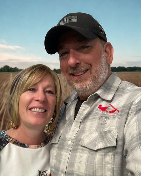 Mom and dad on farm .png