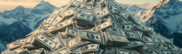 Large pile of cash money with mountain backdrop representing wealth.