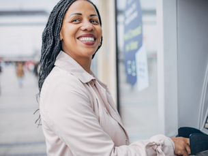 Black Lady in front of an atm