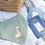 "les petits becs" bib set