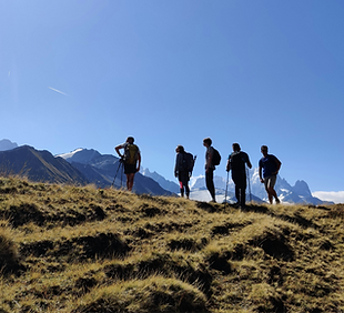 a group of people standing on top of a g