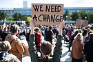 rear-view-of-people-with-placards-and-posters-on-g-2024-10-18-09-54-45-utc.jpg