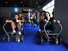 The team pushing the sleds at Sweat 440 Coral Springs