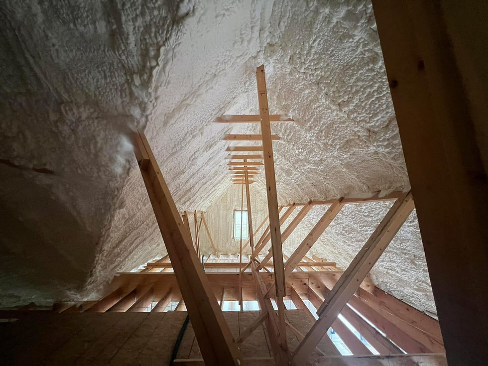 Open cell spray foam applied to a new construction attic