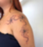 Fine line lilies with flowing lines on the shoulder by Wanessa