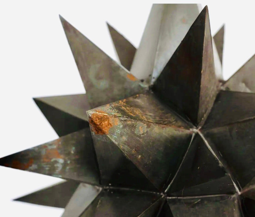 detail, close-up shot of metal starburst lamp