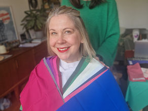 A colour analysis client smiling and happy with her winter colour draping