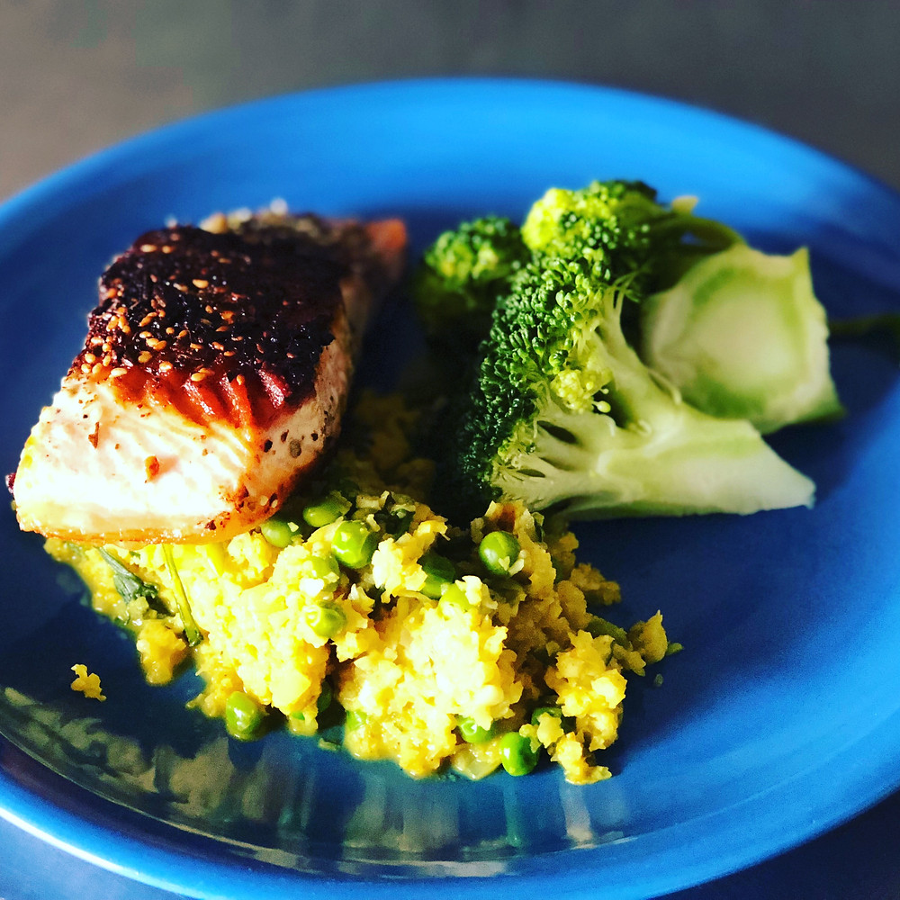 Turmeric cauliflower risotto with pan fried salmon and broccoli