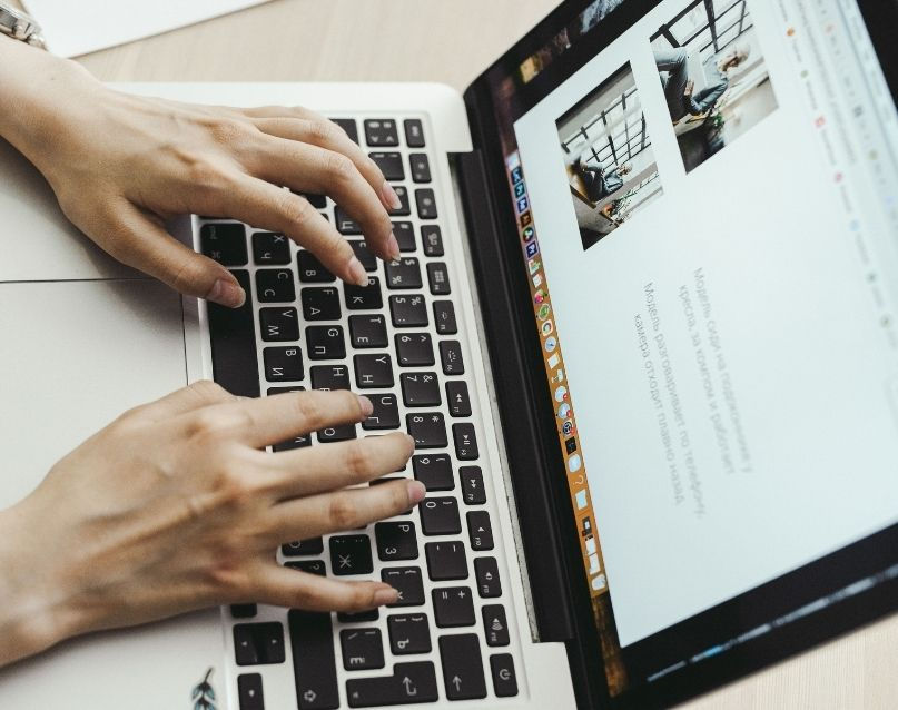 Wix Website Designer and SEO working on a laptop