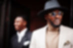 Two fashion black men. Fashionable portrait of african american male models. Wear suit, co