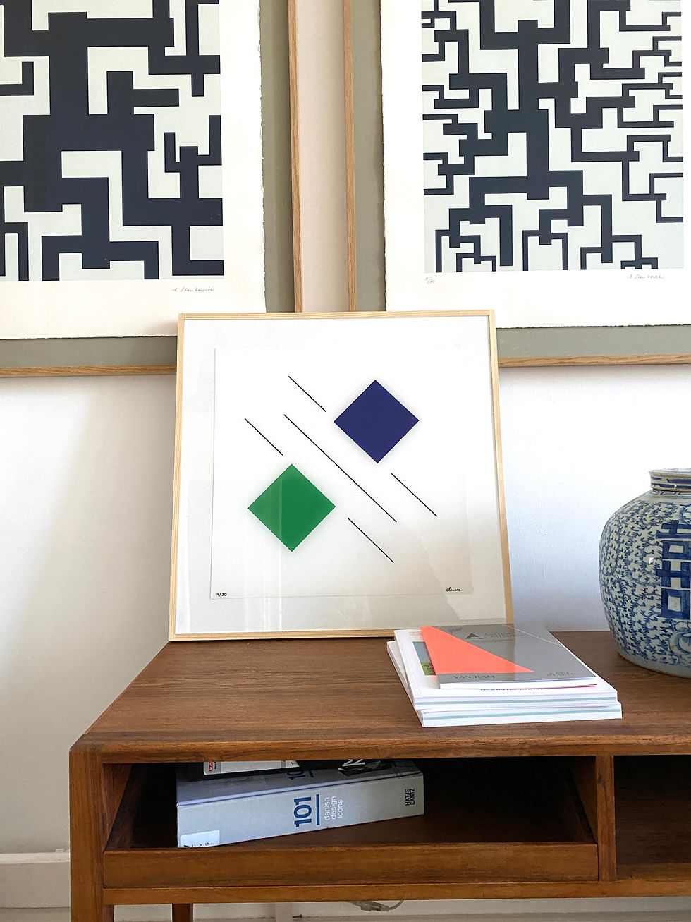 Thumbnail: Geneviève Claisse geometric artwork displayed on desk, modern interior