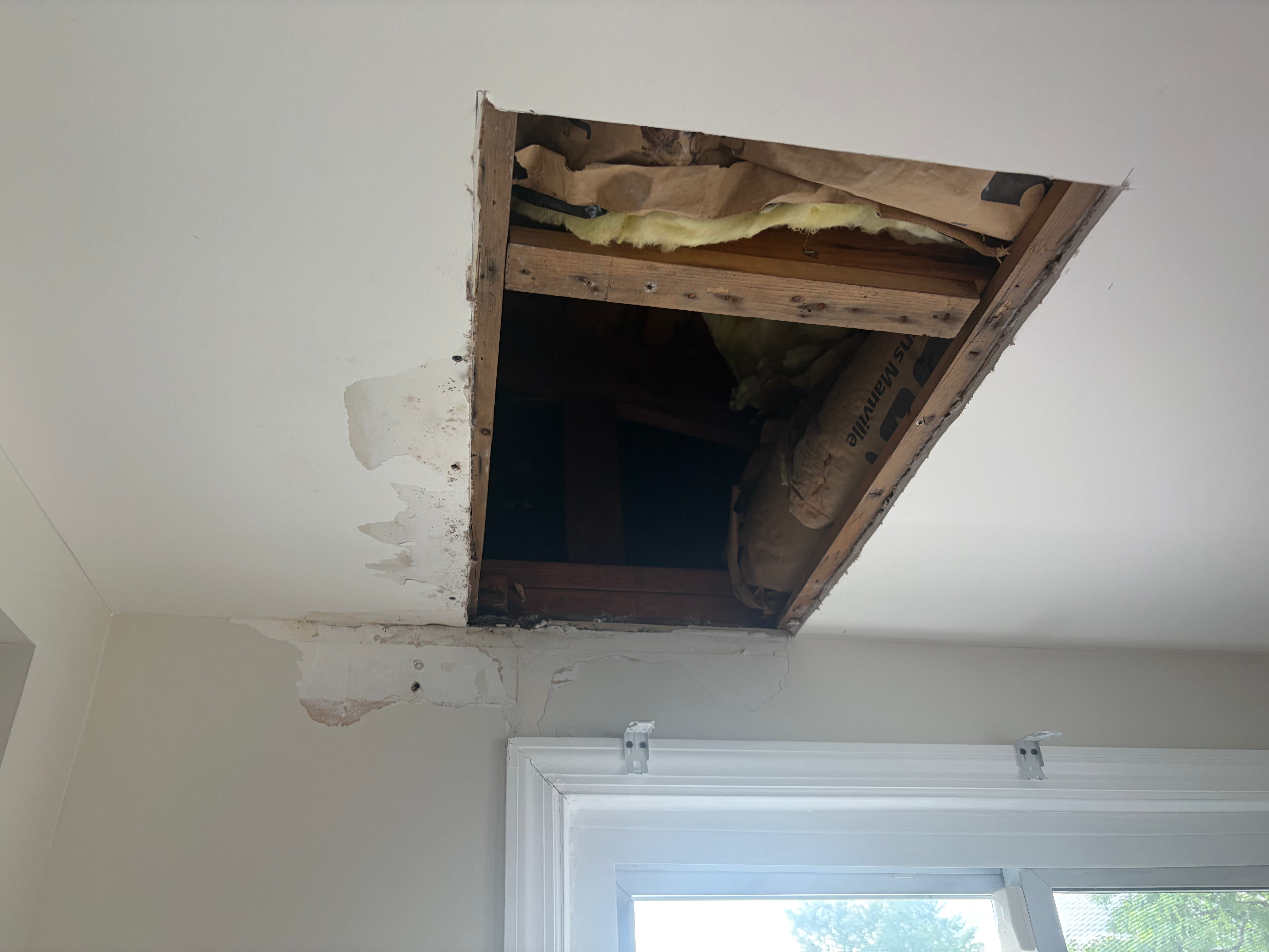 Water-damage ceiling cutout in Bergen County, NJ — HomeGrown Roots & Repairs always identifies the leak source before patching