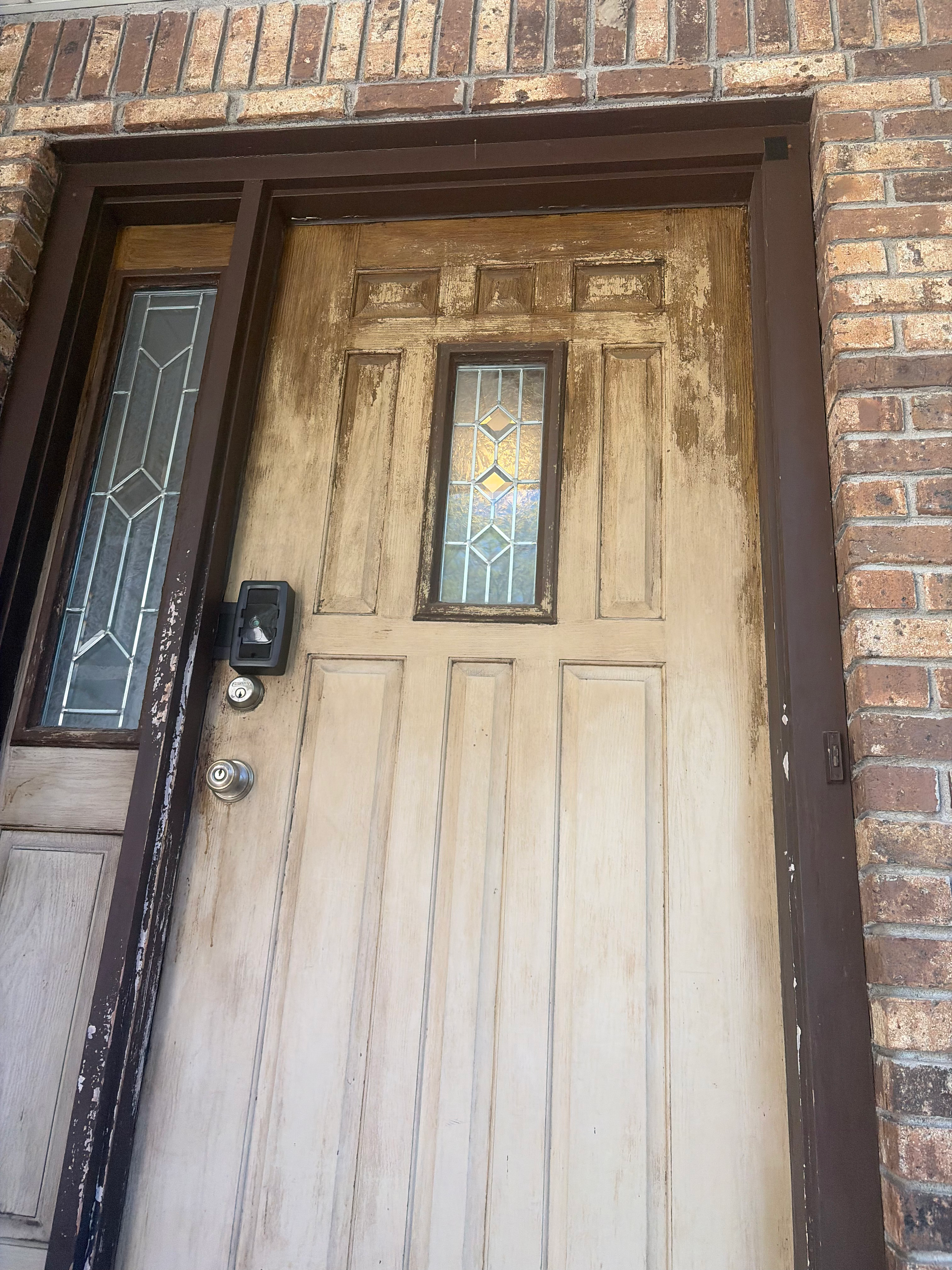 Exterior front door before refinish in Bergen County, NJ — peeling stain and weathered wood before HomeGrown Roots & Repairs prep