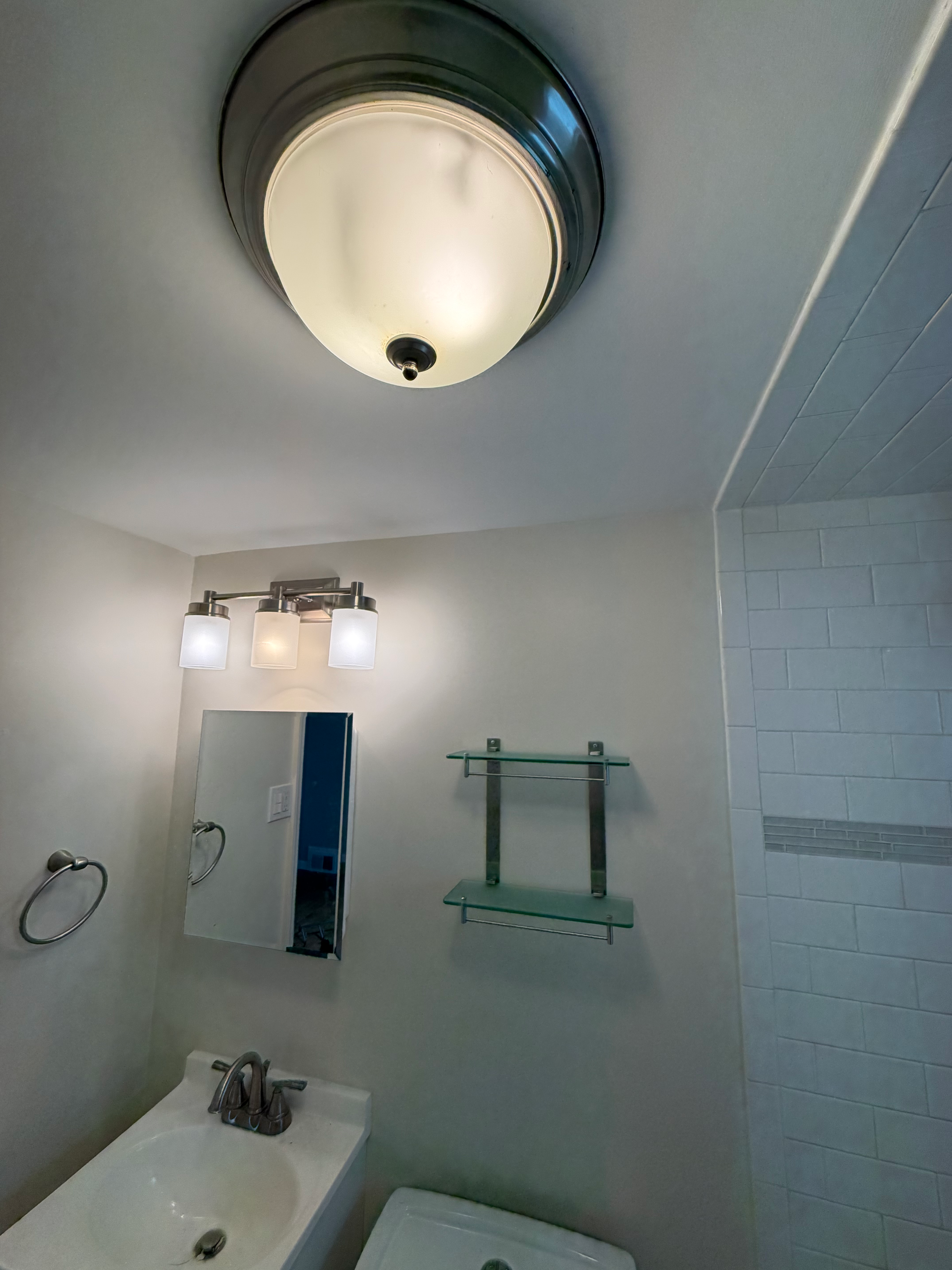 Bathroom remodel detail in Bergen County, NJ — subway tile shower wall with accent tile band niche