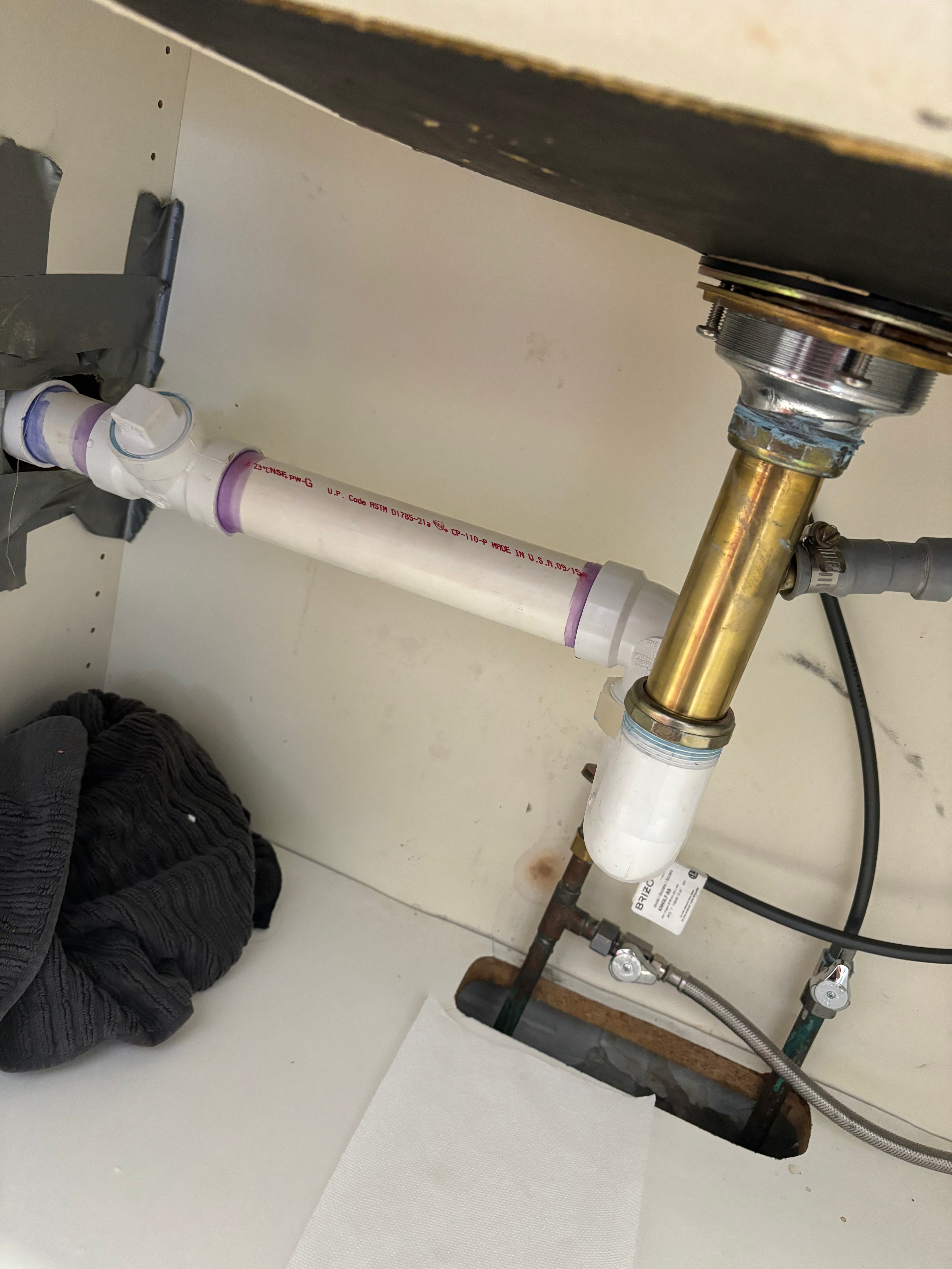Licensed plumber performing pipe repair inside a Montvale NJ residential basement