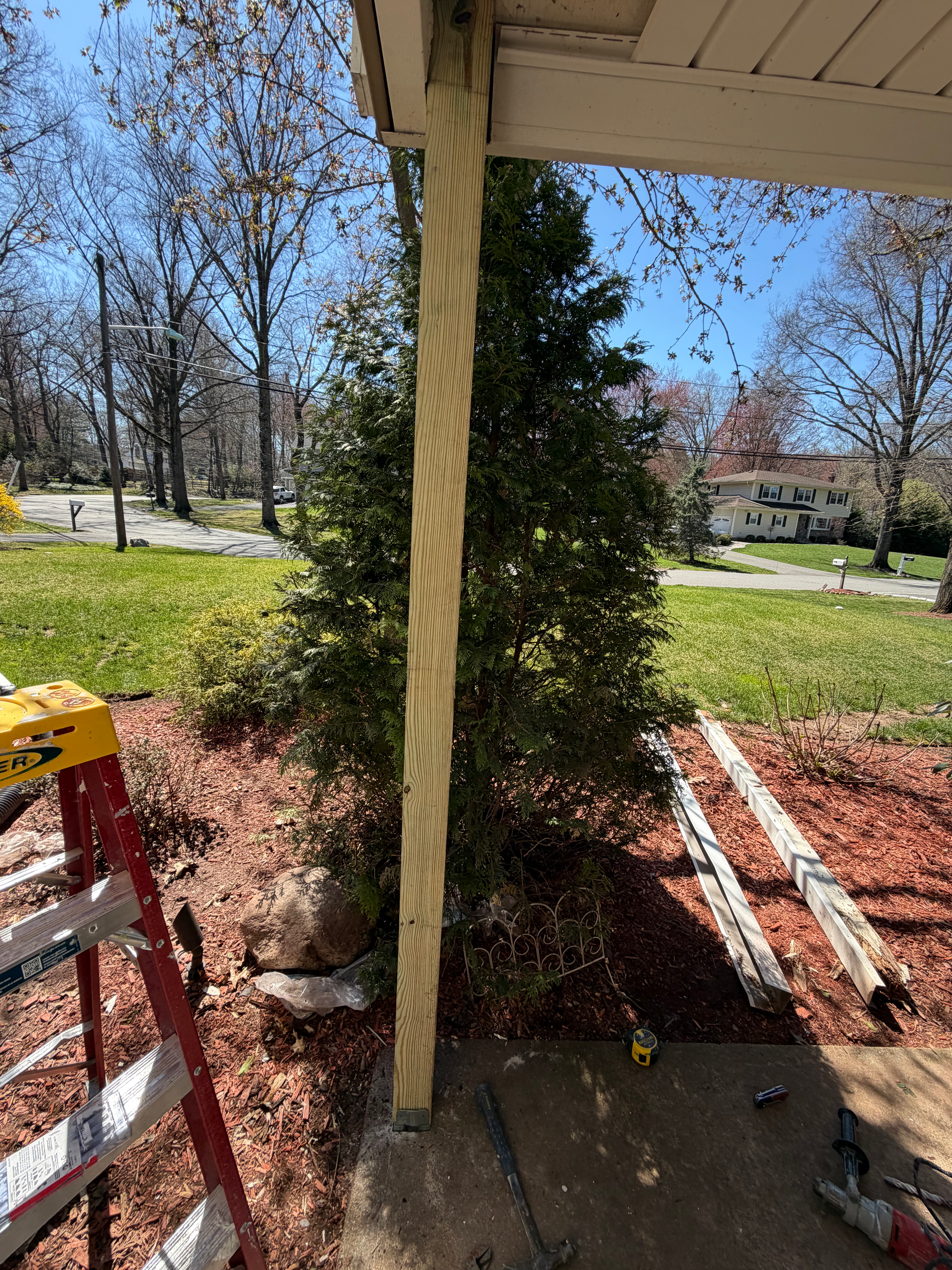 Porch column exterior paint finished in Bergen County, NJ — two coats of premium exterior latex, edges feathered into siding