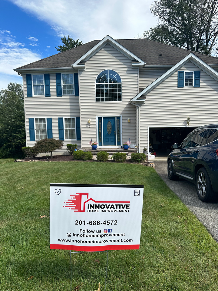 Beautifully renovated house exterior by Innovative Home Improvement.