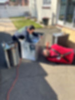H. Hofmeister & Co. Inc. Plumbing Heating AC Sewer Guys working on ac unit