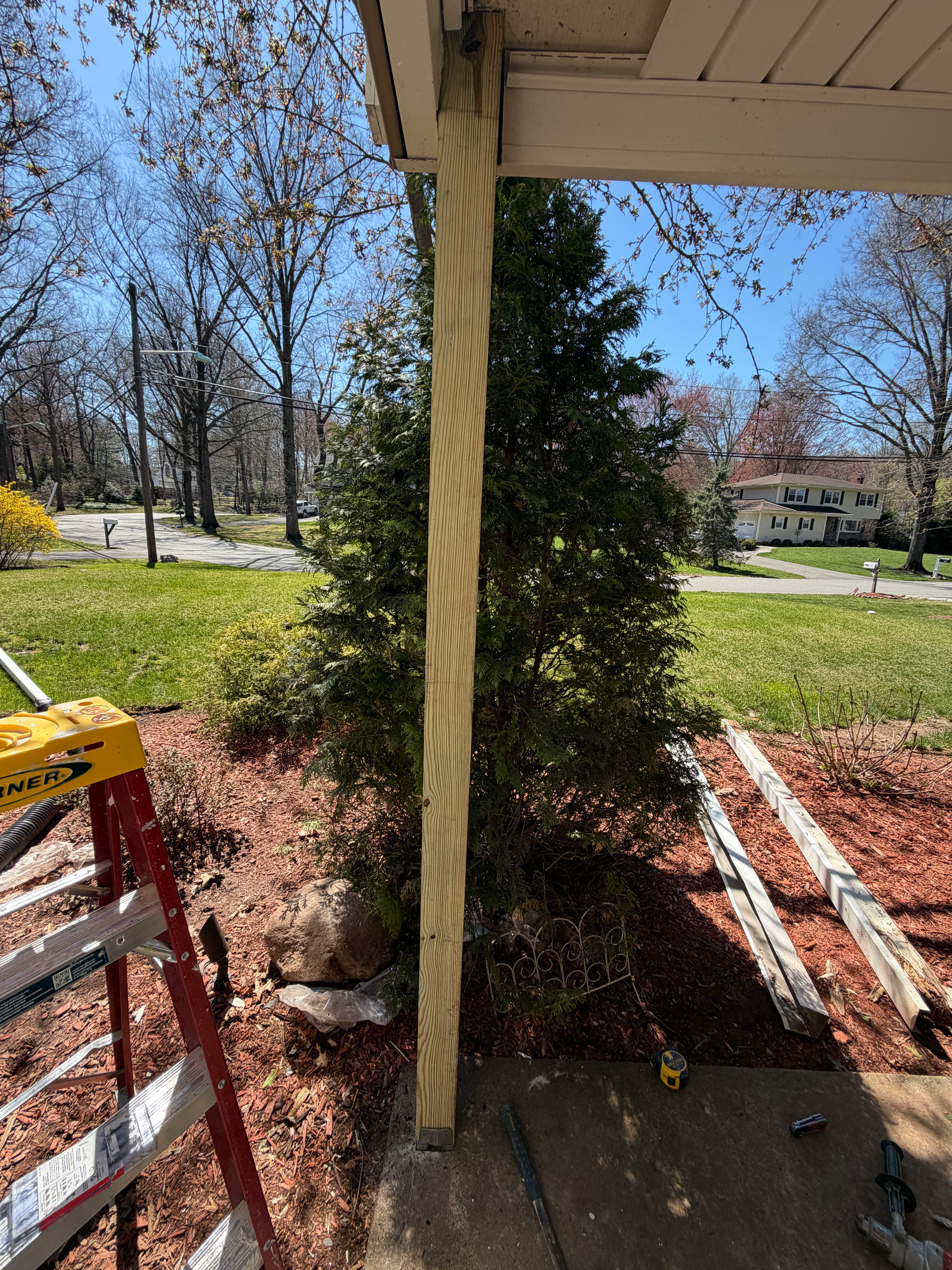 Porch column prep for exterior paint in Bergen County, NJ — masked, sanded, and primed before final coats