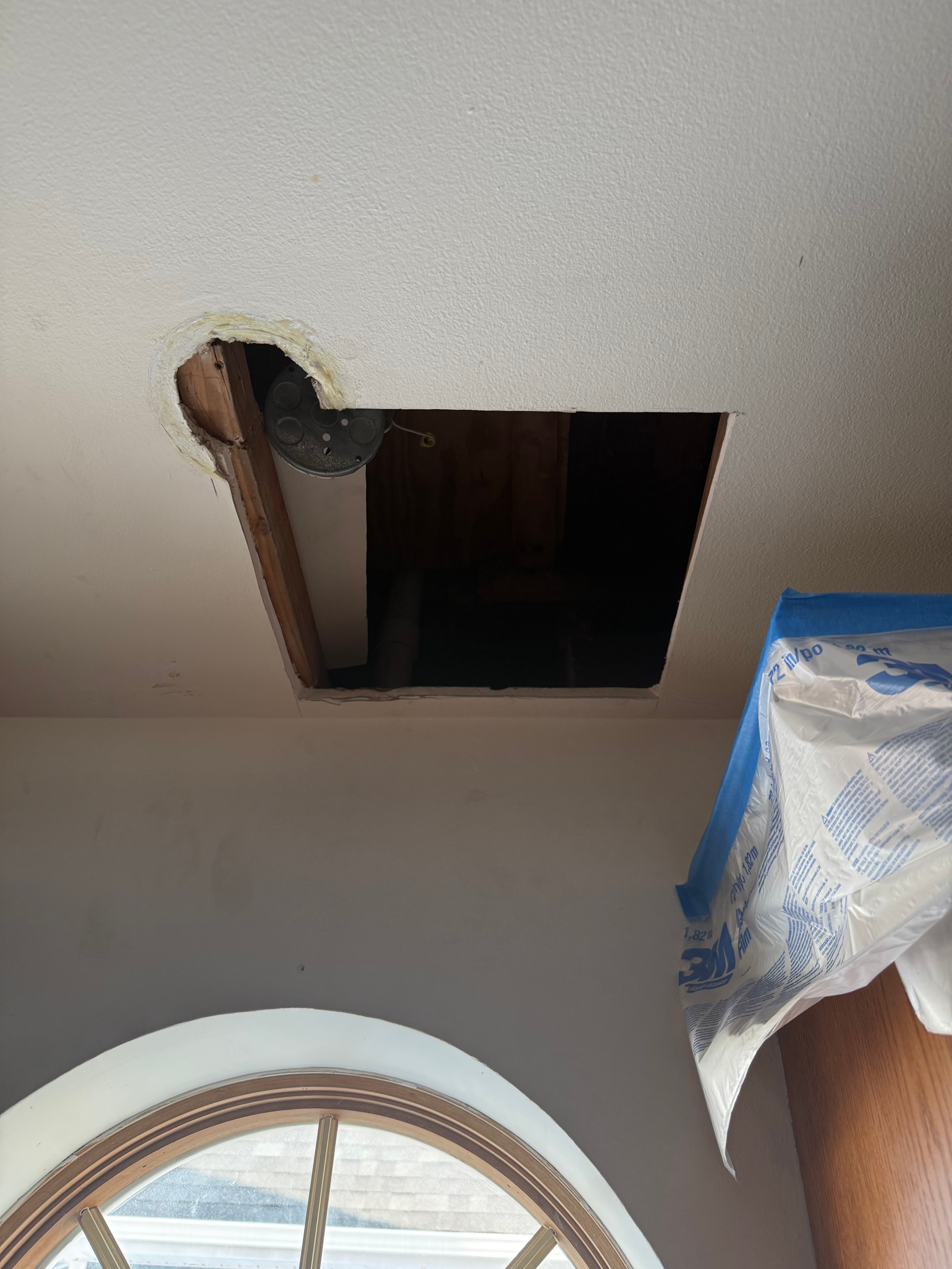 Square ceiling cutout for electrical access in Bergen County, NJ — clean cut prep before drywall patch and three-coat finish