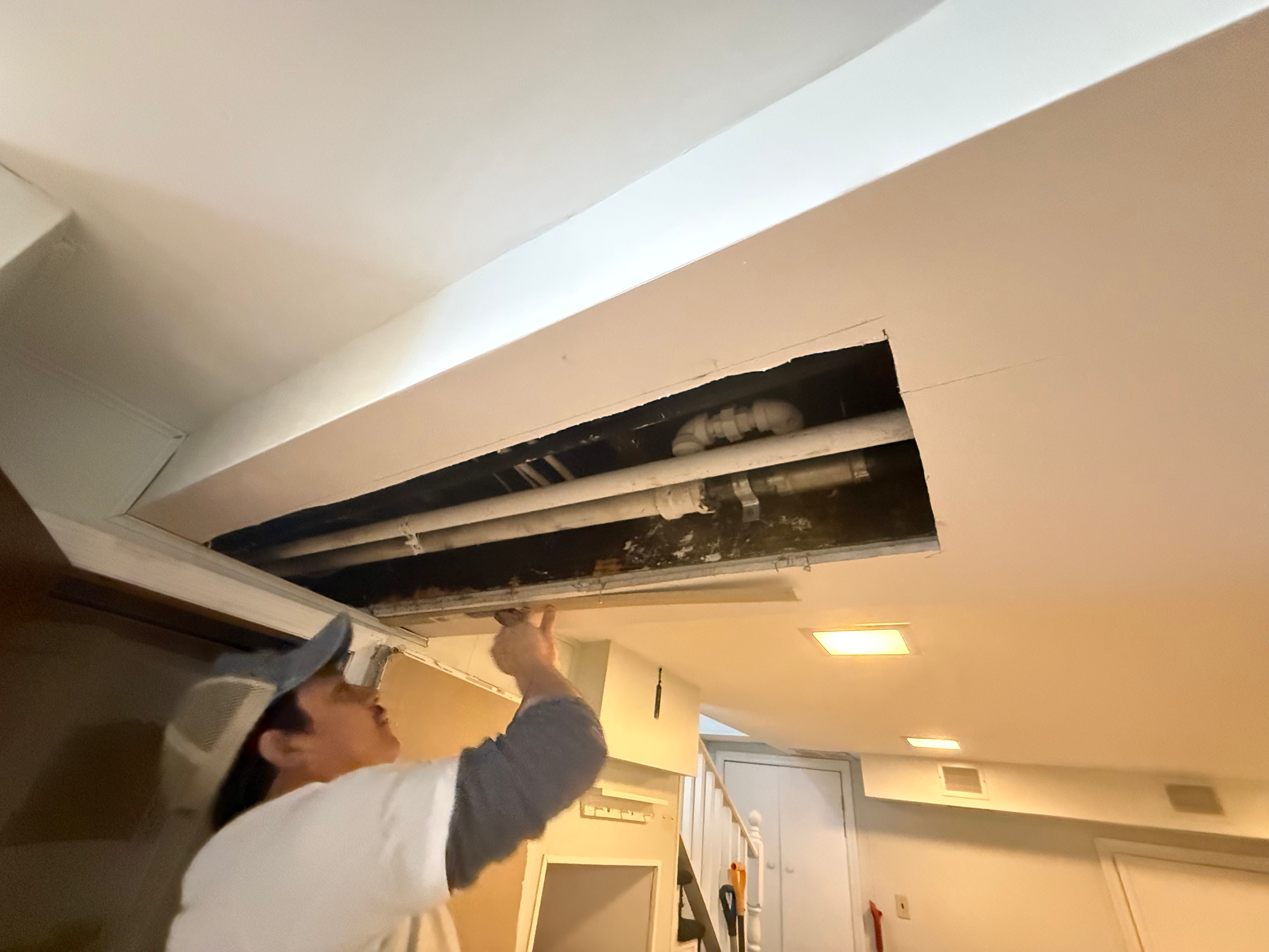 Drywall ceiling patch in progress in Bergen County, NJ — licensed contractor #13VH13595500 patching after plumbing-access work