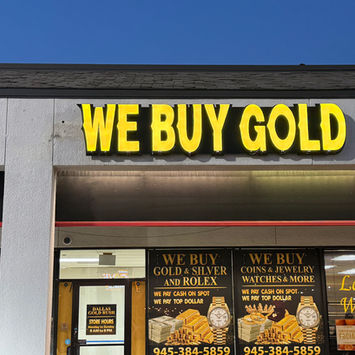 We Buy Gold" business signage at Dallas Gold Rush
