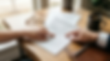 Hands reviewing a hospital insurance claim form