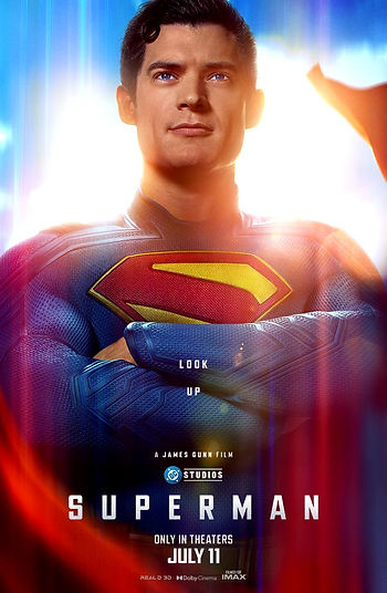 Superman in a blue suit with red and yellow emblem stands confidently against a bright sky. Text: "Look Up," "Superman," "July 11."