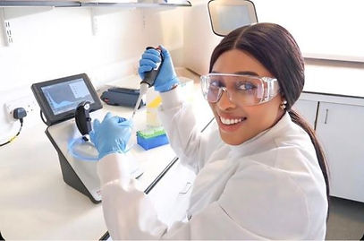 Student performing pipetting technique while preparing samples in laboratory training session