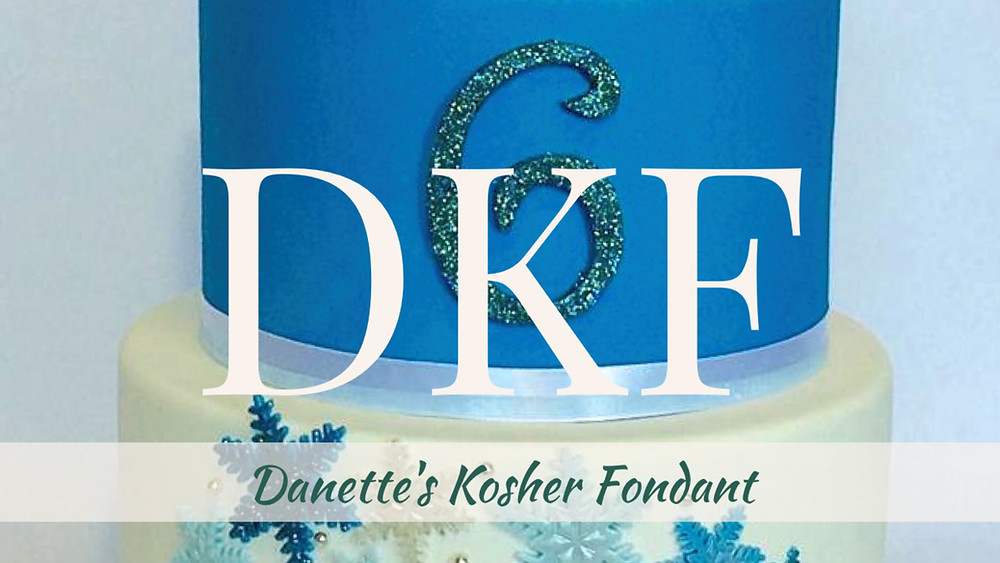 Three tiered cake covered in DKF.