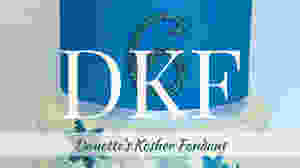 Three tiered cake covered in DKF.