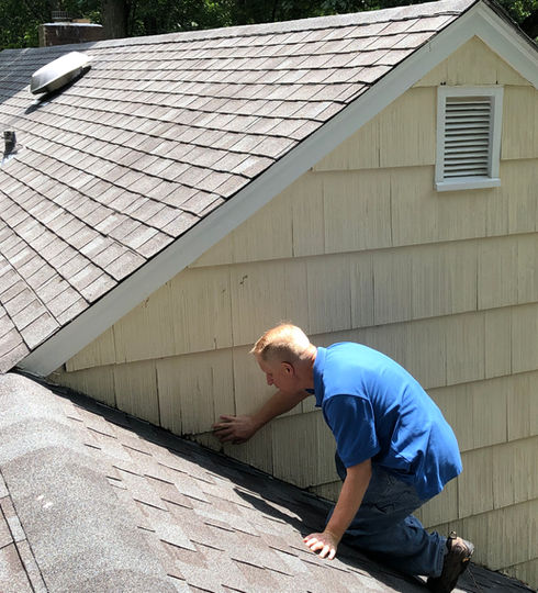 Norm Stafford Conducting Under Sink Inspection
