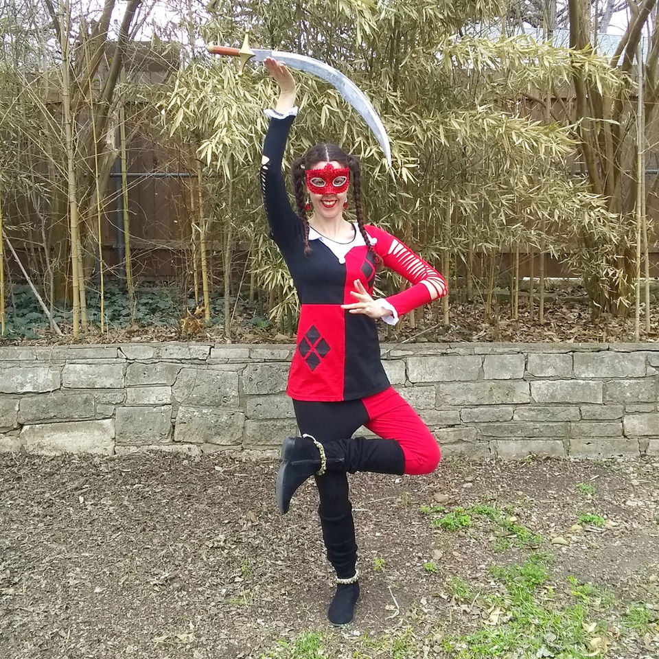 Mystica Fay aka Mystica Fae or Mystica Faye or Mystica Fiora as a jester Harlequin performer with sword for a school carnival, currently a Melbourne circus performer