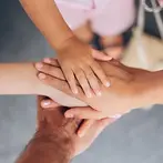 close-up-family-hands-stacked-together-showing-love-unity-connection-touching-symbolizing-