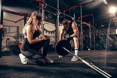 athletic-man-woman-with-dumbbells_edited.jpg