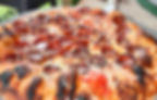 Pepperoni pizza with a charred crust from Pizza Creations