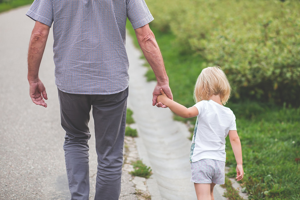 Man walking with girl - DAK Financial Group - Single Premium Life Insurance